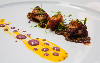 Grilled octopus, white quinoa and olives